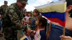 Juan Pablo Rodriguez, Commander of the Colombian Military Forces, greets children during the army's arrival to an area that was previously occupied by FARC rebels, in Meta, Colombia June 1, 2017. Picture taken June 1, 2017. REUTERS/Jaime Saldarriaga