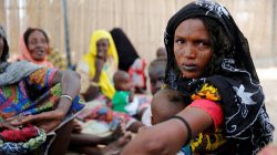A woman sits outside a shed as she waits for food rations at an internally displaced persons (IDP) camp on the outskirts of Maiduguri, northeast Nigeria June 6, 2017. REUTERS/Akintunde Akinleye