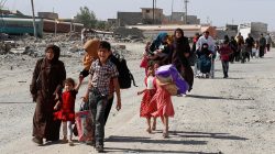 Residents who fled their homes due to fighting between Iraqi forces and Islamic State militants return to their village cleared by the Iraqi forces in western Mosul in Iraq June 7, 2017. REUTERS/Erik De Castro