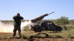 FILE PHOTO: A rebel fighter from the Ahrar al-Sham Islamic Movement reacts as they fire grad rockets from Idlib countryside, towards forces loyal to Syria's President Bashar al-Assad stationed at Jureen town in al-Ghab plain in the Hama countryside, Syria, April 25, 2015. REUTERS/Mohamad Bayoush/File Photo
