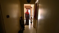 Noura Khodr Khalaf, 24, a Yazidi woman who was recently freed from Islamic State, stands with her children in a centre belonging to the Kurdish-led administration in Qamishli, Syria June 10, 2017. Picture taken June 10, 2017. REUTERS/Rodi Said