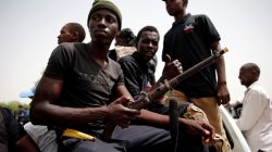 Members of the local militia, otherwise known as CJTF, sit in the back of a truck during a patrol in the city of Maiduguri, northern Nigeria June 9, 2017. Picture taken June 9, 2017. REUTERS/Akintunde Akinleye.