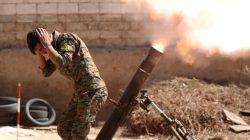 A Kurdish fighter from the People's Protection Units (YPG) fires a 120 mm mortar round in Raqqa, Syria, June 15, 2017. REUTERS/Goran Tomasevic