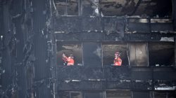 Members of the emergency services work inside the charred remains of the Grenfell apartment tower block in North Kensington, London, Britain, June 17, 2017. REUTERS/Hannah McKay