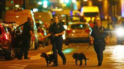 Police officers attend to the scene after a vehicle collided with pedestrians near a mosque in the Finsbury Park neighborhood of North London, Britain June 19, 2017.