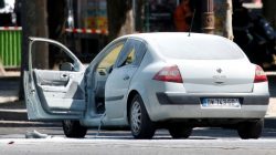 A burned car is seen on the Champs Elysees avenue after an incident in Paris, France, June 19, 2017.