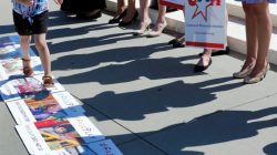 Activists rally outside U.S. Supreme Court after the Court sided with Trinity Lutheran Church, which objected to being denied public money in Missouri, in Washington, U.S.,