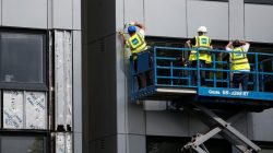 Cladding is removed from the side of Whitebean Court in Salford, Manchester,