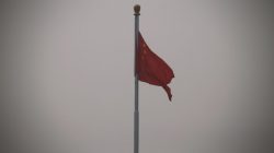 FILE PHOTO: A Chinese national flag flutters at Tiananmen Square in Beijing October 20, 2014. REUTERS/Petar Kujundzic