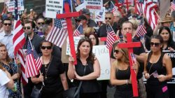 FILE PHOTO: Protesters rally outside the federal court just before a hearing to consider a class-action lawsuit filed on behalf of Iraqi nationals facing deportation, in Detroit, Michigan, U.S., June 21, 2017. REUTERS/Rebecca Cook