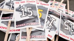 FILE PHOTO: Protest signs are pictured in SeaTac, Washington just before a march from SeaTac to Seattle aimed at the fast food industry and raising the federal minimum wage and Seattle's minimum wage to $15 an hour December 5, 2013. REUTERS/David Ryder/File Photo