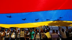 Demonstrators holding a Venezuelan flag attend a rally against Venezuela's President Nicolas Maduro's government in Caracas, Venezuela June 27, 2017. REUTERS/Ivan Alvarado