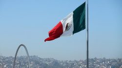 A Mexican flag is seen over the city of Tijuana, Mexico from San Ysidro, a district of San Diego, California, U.S., April 21, 2017. REUTERS/Mike Blake