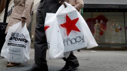 FILE PHOTO: A customer exits after shopping at a Macy's store in the Brooklyn borough of New York, U.S., on May 11, 2017. REUTERS/Brendan McDermid/File Photo