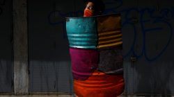 A demonstrator holding a rudimentary shield poses for a picture before a rally against Venezuelan President Nicolas Maduro's government in Caracas, Venezuela, May 27, 2017. He said: "I protest, because I want a better future for me and my family, because it hurts to get up every day and have my mother crying because there is nothing to eat at home. Because I know that if I've got to die here, I would die fighting for my country and not because I was shot by someone who wanted to steal my cell phone." REUTERS/Carlos Garcia Rawlins