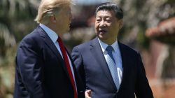 U.S. President Donald Trump and China's President Xi Jinping chat as they walk along the front patio of the Mar-a-Lago estate after a bilateral meeting in Palm Beach, Florida, U.S., April 7,