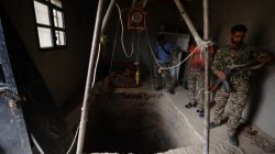 Syrian Democratic Forces fighters inspect a tunnel dug by Islamic State militants inside a house in Raqqa's al-Sanaa industrial neighborhood. REUTERS/Rodi Said