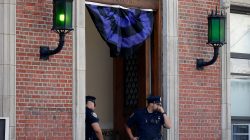 Black and blue bunting hangs from above the entrance to the New York City Police Department's 46th precinct after a gunman fatally shot a female New York City Police Department officer in an unprovoked attack early on Wednesday in the city's Bronx borough of New York City, U.S., July 5, 2017. REUTERS/Mike Segar