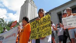 FILE PHOTO: Members of the University of Texas of the Guns Free UT group that includes faculty and staff protest against a state law that allows for guns in classrooms at college campuses, in Austin, Texas, U.S. August 24, 2016. REUTERS/Jon Herskovitz/File Photo