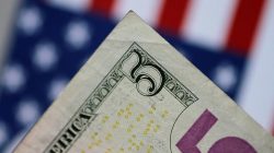 A U.S. five dollar note is seen in this picture illustration June 2, 2017. REUTERS/Thomas White/Illustration