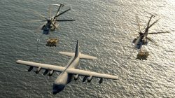 FILE PHOTO: Two U.S. Marine Corps CH-53E Super Stallion helicopters receive fuel from a KC-130 Hercules over the Gulf of Aden January 1, 2003. U.S. Marine Corps/Cpl. Paula M. Fitzgerald/Handout/File Photo via REUTERS