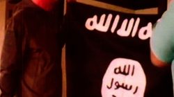 A photograph with a redacted date, and entered into federal court as an exhibit to support the government's motion to keep U.S. Army Sergeant Ikaika Erik Kang in detention without bond, shows what is described as Kang holding the Islamic State Flag after pledging allegiance to the Islamic State. Kang is charged with trying to provide material support to Islamic State extremists. the U.S. District Court for the District of Hawaii/Handout via REUTERS