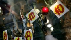 FILE PHOTO - Prices are seen on replica Statues of Liberty figures in a shop window in New York City, November 14, 2011. REUTERS/Mike Segar
