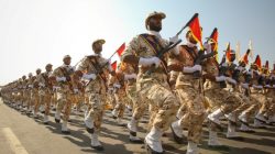 Members of the Iranian revolutionary guard march during a parade to commemorate the anniversary of the Iran-Iraq war (1980-88), in Tehran
