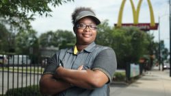 McDonald's employee Ashley Bruce poses in front of the restaurant where she works in Chicago, Illinois, U.S.