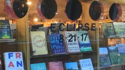 Books and a cardboard cutout representation of the moon eclipsing the sun on August 21, 2017 are seen at a bookstore in Jackson, Wyoming, U.S. July 12, 2017. Picture taken July 12, 2017. REUTERS/Ann Saphir