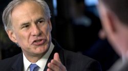 FILE PHOTO: Texas governor Greg Abbott speaks during an interview on the floor of the New York Stock Exchange in New York, U.S. on July 14, 2015. REUTERS/Brendan McDermid/File Photo