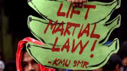 An anti martial law protestor hold a placard while protesting during the special session on the extension of martial law at the House of Representatives in Quezon City, metro Manila, Philippines July 22, 2017. REUTERS/Dondi Tawatao