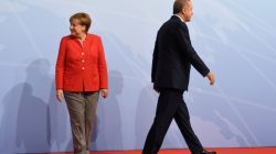 FILE PHOTO: German Chancellor Angela Merkel greets Turkey's President Recep Tayyip Erdogan at the beginning of the G20 summit in Hamburg, Germany, July 7, 2017. REUTERS/Bernd Von Jutrczenka/POOL/File Photo