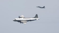 FILE PHOTO: A U.S. Navy EP-3E Aries signals reconnaissance aircraft, escorted by an EA-18G Growler electronic warfare aircraft, performs a flyby over aircraft carrier USS Harry S. Truman in the Arabian Gulf April 24, 2016. U.S. Navy/Mass Communication Specialist 3rd Class Bobby J Siens/Handout/File Photo via REUTERS