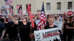 FILE PHOTO: Protesters rally outside the federal court just before a hearing to consider a class-action lawsuit filed on behalf of Iraqi nationals facing deportation, in Detroit, Michigan, U.S., June 21, 2017. REUTERS/Rebecca Cook/File Photo