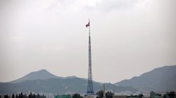 A North Korean flag flutters on top of a tower at the propaganda village of Gijungdong in North Korea, in this picture taken near the truce village of Panmunjom, South Korea July 19, 2017. REUTERS/Kim Hong-Ji