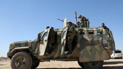 FILE PHOTO - Syrian Democratic Forces (SDF) stand on their military vehicle in northern Deir al-Zor province ahead of an offensive against Islamic State militants, Syria February 21, 2017. REUTERS/Rodi Said
