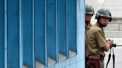 North Korean soldiers watch the south side as the United Nations Command officials visit after a commemorative ceremony for the 64th anniversary of the Korean armistice at the truce village of Panmunjom in the Demilitarized Zone (DMZ) dividing the two Koreas July 27, 2017. REUTERS/Jung Yeon-Je/Pool