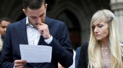 Charlie Gard's parents Connie Yates and Chris Gard read a statement at the High Court after a hearing on their baby's future, in London. REUTERS/Peter Nicholls
