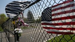A makeshift memorial stands outside a park, where bodies of four men were found on April 13, in Central Islip, New York, U.S., April 28, 2017. REUTERS/Shannon Stapleton