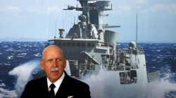 FILE PHOTO: Commander of the U.S. Pacific Fleet Admiral Scott Swift sits in front of a large poster of an Australian Navy frigate as he speaks during a media conference at the 2015 Pacific International Maratime Exposition in Sydney, Australia, October 6, 2015. To match Special Report USA-TRUMP/CARRIERS REUTERS/David Gray/File Photo