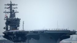 FILE PHOTO - Sailors man the rails as aircraft carrier USS Nimitz with Carrier Strike Group 11, and some 7,500 sailors and airmen depart for a 6 month deployment in the Western Pacific from San Diego, California, U.S., June 5, 2017. REUTERS/Mike Blake tensions with Iran