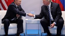 FILE PHOTO - U.S. President Donald Trump shakes hands with Russia's President Vladimir Putin during their bilateral meeting at the G20 summit in Hamburg, Germany July 7, 2017. REUTERS/Carlos Barria/File Photo