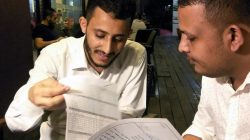 Yemeni Rafek Ahmed Mohammed Al-Sanani (R), 22, and Abdel Rahman Zaid, 26 look through documents as they speak with Reuters in Serdang, on the outskirts of Kuala Lumpur, Malaysia July 20, 2017.