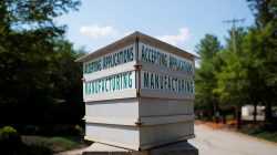 A sign advertises manufacturing jobs at Ideal Concrete Block Company in Westford, Massachusetts, U.S., July 17, 2017. REUTERS/Brian Snyder