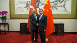 Chinese Foreign Minister Wang Yi (R) shakes hands with Turkish Foreign Minister Mevlut Cavusoglu during their meeting at Diaoyutai State Guesthouse in Beijing, China, 03 August 2017. REUTERS/Roman Pilipey/Pool
