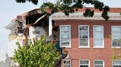 Damage to the building is seen as emergency personnel work the scene of school building collapse at Minnehaha Academy in Minneapolis, Minnesota, U.S., August 2, 2017. REUTERS/Adam Bettcher