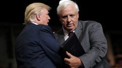 President Trump talks with West Virginia's Democratic Governor Jim Justice after he announced that he is changing parties during a rally in Huntington, West Virginia. REUTERS/Carlos Barria