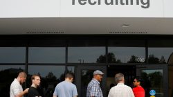 FILE PHOTO - Job seekers line up to apply during "Amazon Jobs Day," a job fair being held at 10 fulfillment centers across the United States aimed at filling more than 50,000 jobs, at the Amazon.com Fulfillment Center in Fall River, Massachusetts, U.S., August 2, 2017. REUTERS/Brian Snyder