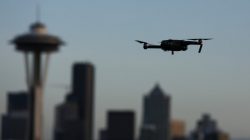 FILE PHOTO: A drone hovers at a viewpoint overlooking the Space Needle and skyline of tech hub Seattle, Washington, U.S. February 11, 2017. REUTERS/Chris Helgren